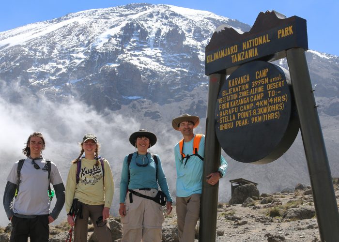 Tourists climb Mount Kilimajaro at Karanga camp