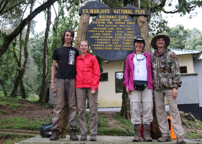 Tourists climb Mount Kilimanjaro at Machame gate